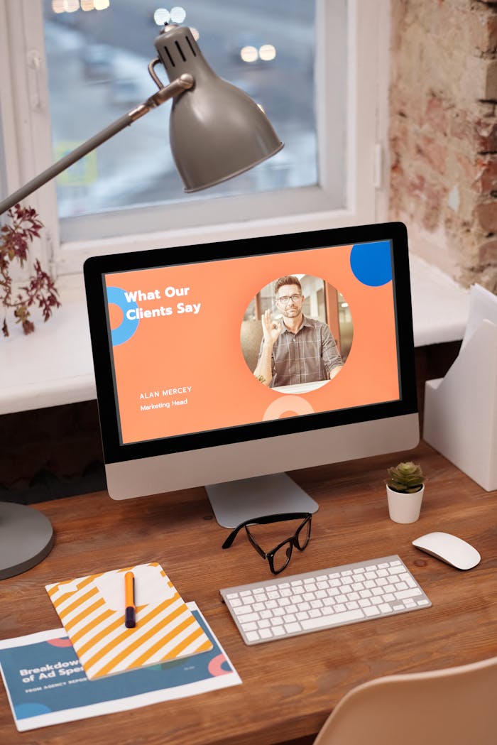 about-01 Stylish home office setup with computer showcasing client testimonials.